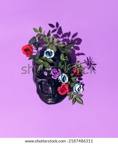 Black human skull mask floral decoration on pastel purple background. Creative gothic style layout. 