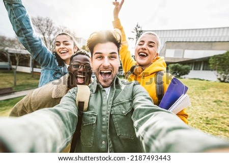 Multicultural students taking selfie picture in college campus - Happy group of friends having fun together outside school - Back to school concept