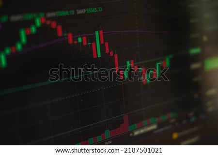 Financial chart, stock analysis data on digital screen. Cryptocurrency growth charts. Blur and selective focus