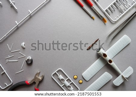 Scale model of the airplane fighter with details. Plastic assembly kit. Top view. Copy space Royalty-Free Stock Photo #2187501553