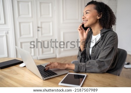 The administrator, a woman with glasses online, makes a report on the work plan for the project, uses a laptop workplace