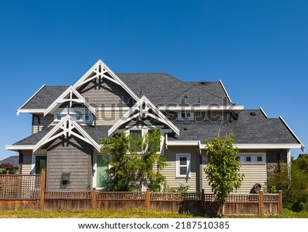 Luxury house in Vancouver, Canada. Big luxury house with a patio on sunny summer day. Selective focus, nobody.