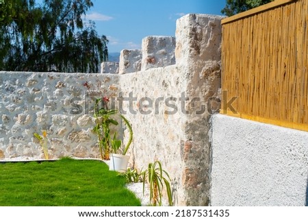 bohemian garden arrangement and masonry walls