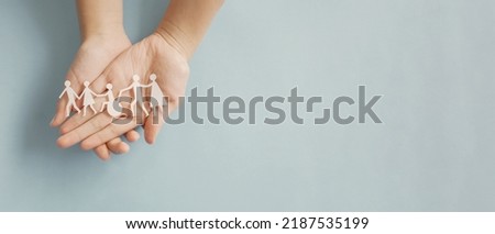 Hands holding diversity family, happpy carer and volunteer, disable nursing home, rehabilitation and health insurance concept Royalty-Free Stock Photo #2187535199