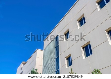 Modern apartment buildings with cube windows in San Francisco, California. Apartment building in a low angle view with picture windows against the clear sky background.