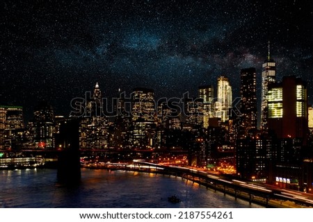 Galaxy of stars shining in the night sky above the buildings of New York City skyline