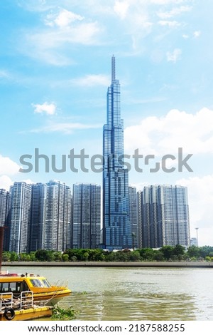 view of blue sky at Landmark 81 is a super tall skyscraper in center Ho Chi Minh City, Vietnam and Saigon bridge with development buildings, energy power infrastructure. Travel concept. Royalty-Free Stock Photo #2187588255