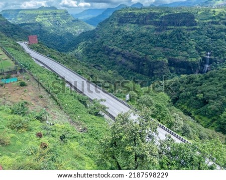 The Mumbai-Pune Expressway during the monsoon season at Khandala near Pune India. The Expressway is officially called the Yashvantrao Chavan Expressway. Royalty-Free Stock Photo #2187598229
