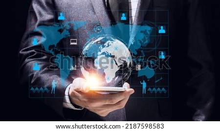 Success Businessman ues smartphone digital technology link internet connection network earth global financial world banking.hologram icon and business world success technology on black background Royalty-Free Stock Photo #2187598583