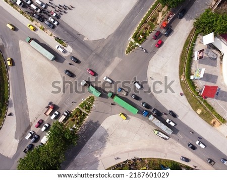 A view of instersection road in Batam City, Indonesia. this photo was shot in the afternoon where the traffic is high.