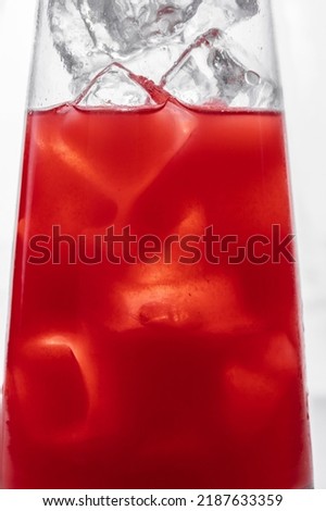 Cocktail in a glass with ice on a white background