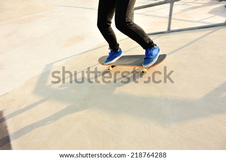skateboarding legs at skatepark 