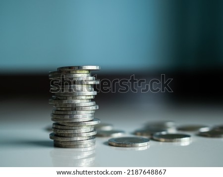 Stack coin closeup on blue background.bank currency Thai. plan income investment growth and saving for 2023 new year.for salary,rate,stock market,credit,loan,business or treasury finance concept. Royalty-Free Stock Photo #2187648867