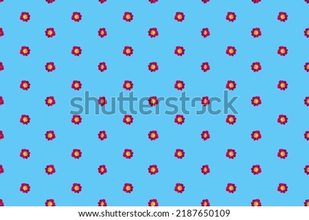 Seamless pattern with burgundy small flowers on a blue background.