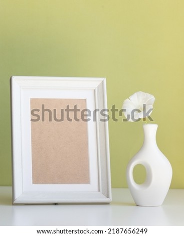 product mock up with white frame with space for text and white vase