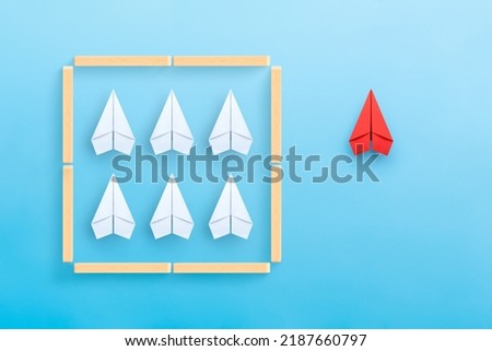 Think outside the box, different thinking, Business for solution concept with paper planes on blue background