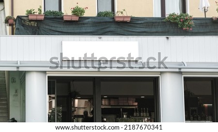 Empty information banner mounted on wall of hotel or restaurant front view