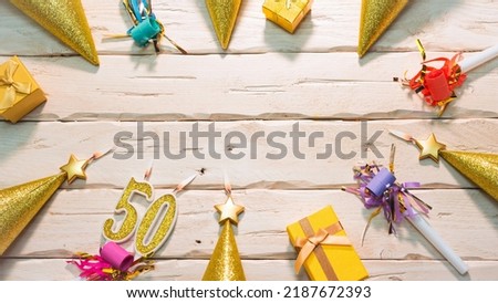 Beautiful colorful card on the background of white boards happy birthday in golden hues copy space. Beautiful ornaments and decorations of gold color festive background. Happy birthday number 50
