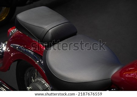 Black leather seats of classic motorcycles.