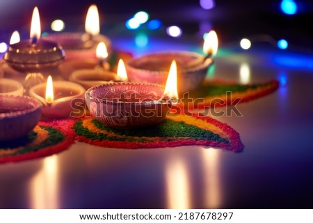 Oil lamps lit on street at night during diwali celebration Royalty-Free Stock Photo #2187678297