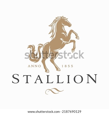 Horse logo. Stallion emblem. Wild mustang rearing icon. Luxury equine estate brand identity. Gold equestrian label design. Vector illustration. Royalty-Free Stock Photo #2187690129