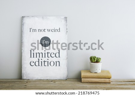 motivational inspirational poster quote I'm not weird, I'm limited edition on the white wall. American or Scandinavian style room interior. 
