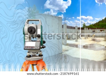 Geodetic electronic device. Optical level at construction site. Equipment for surveyor on tripod. Geodetic equipment is aimed at walls and columns. Geodetic inspection during construction.  Royalty-Free Stock Photo #2187699161