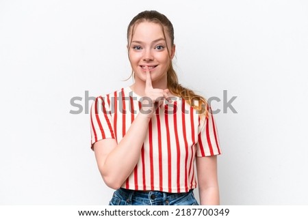Young caucasian girl isolated on white background showing a sign of silence gesture putting finger in mouth
