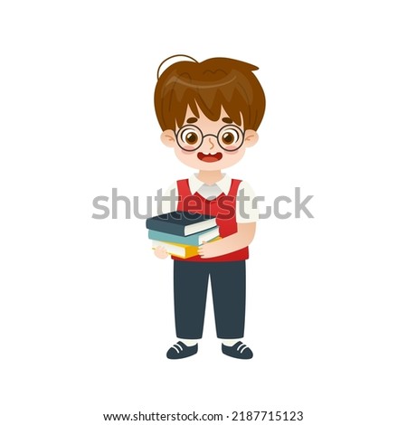 Cute little school boy standing and holding stack of books. Adorable happy pupil holding books. Royalty-Free Stock Photo #2187715123