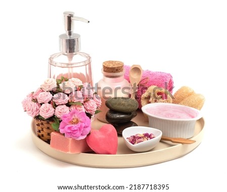Damask rose flowers and soap,shampoo and others isolated on white background.
