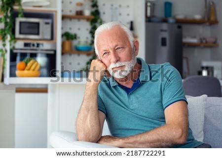Bored tired sad mature man depressed lonely having no visitors of his children. Divorce , bachelor , health problems concept. Lockdown, unemployment, needless man on social distance Royalty-Free Stock Photo #2187722291