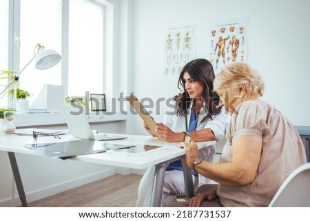Cropped shot of an attractive young female doctor consulting with a patient inside her office at a hospital. Female doctor looking at test results of her patient. Health care concept