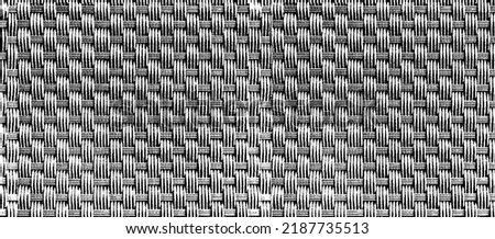 Vector wicker textured background. Handcraft woven texture. Retro woven pattern. Abstract halftone vector illustration. Overlay for interesting effect and depth. Black isolated on white. EPS10 Royalty-Free Stock Photo #2187735513