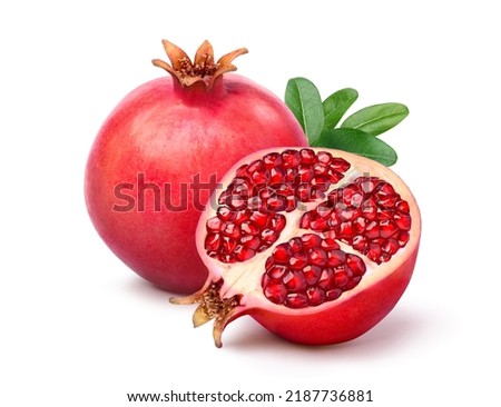 Fresh ripe pomegranate with cut in half isolated on white background. Clipping path. Royalty-Free Stock Photo #2187736881