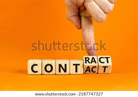 From contact to contract symbol. Businessman turns wooden cubes and changes the word 'contact' to 'contract'. Beautiful orange background, copy space. Business, from contact to contract concept.