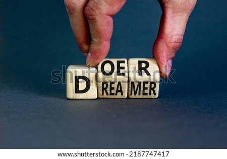 Doer or dreamer symbol. Concept words Doer or dreamer on wooden cubes. Businessman hand. Beautiful grey table grey background. Business and doer or dreamer concept. Copy space. Royalty-Free Stock Photo #2187747417