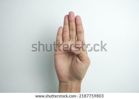 Alphabet - letter B spelling by woman's hand in American Sign Language (ASL) on white background