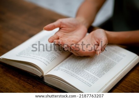 Picture of a person sitting next to a prayer book. Christian Crisis Prayer To God. Bible Study Faith Goodness Prayer God.