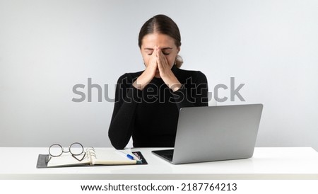Tired woman after hard work at the laptop. High quality photo