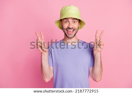 Photo of cheerful optimistic guy tourist trendy outfit good mood take photo rest vacation good weekend isolated on pink color background