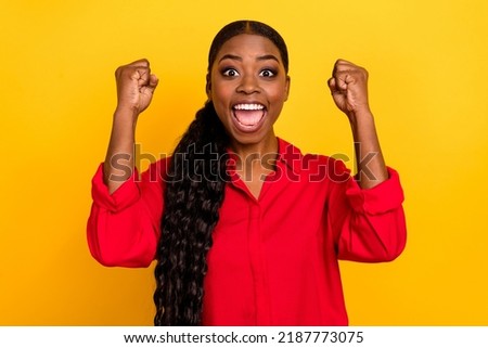 Photo of young excited girl rejoice luck ecstatic lottery fists hands triumph isolated over yellow color background Royalty-Free Stock Photo #2187773075