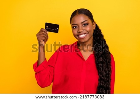 Photo of young pretty girl credit card income benefit profit cashback isolated over yellow color background