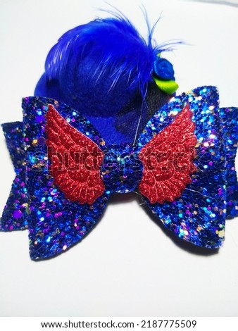 women's blue hair clip with a small hat