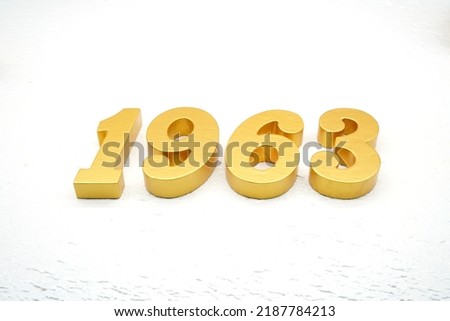   Number 1963 is made of gold painted teak, 1 cm thick, laid on a white painted aerated brick floor, visualized in 3D.                                 