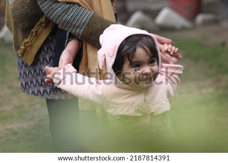 cute little girl playing, enjoying, and posing for photos 