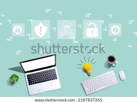 Virus and scam theme with computers with a light bulb from above
