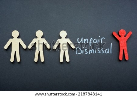 Figures and one red next to the inscription unfair dismissal. Royalty-Free Stock Photo #2187848141