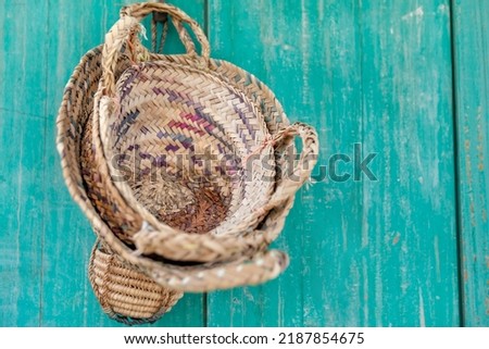 Weaved baskets from dried palm leaves, traditional Emirati handicraft. Handmade UAE arts and crafts. High quality photo. Royalty-Free Stock Photo #2187854675