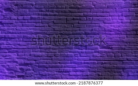 Neon lights on old grunge brick wall room background.