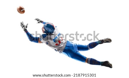 Up. American football. Player catches the ball and flies in the air. Back view. Sportsman in action. Isolated on white background. Sport Royalty-Free Stock Photo #2187915301